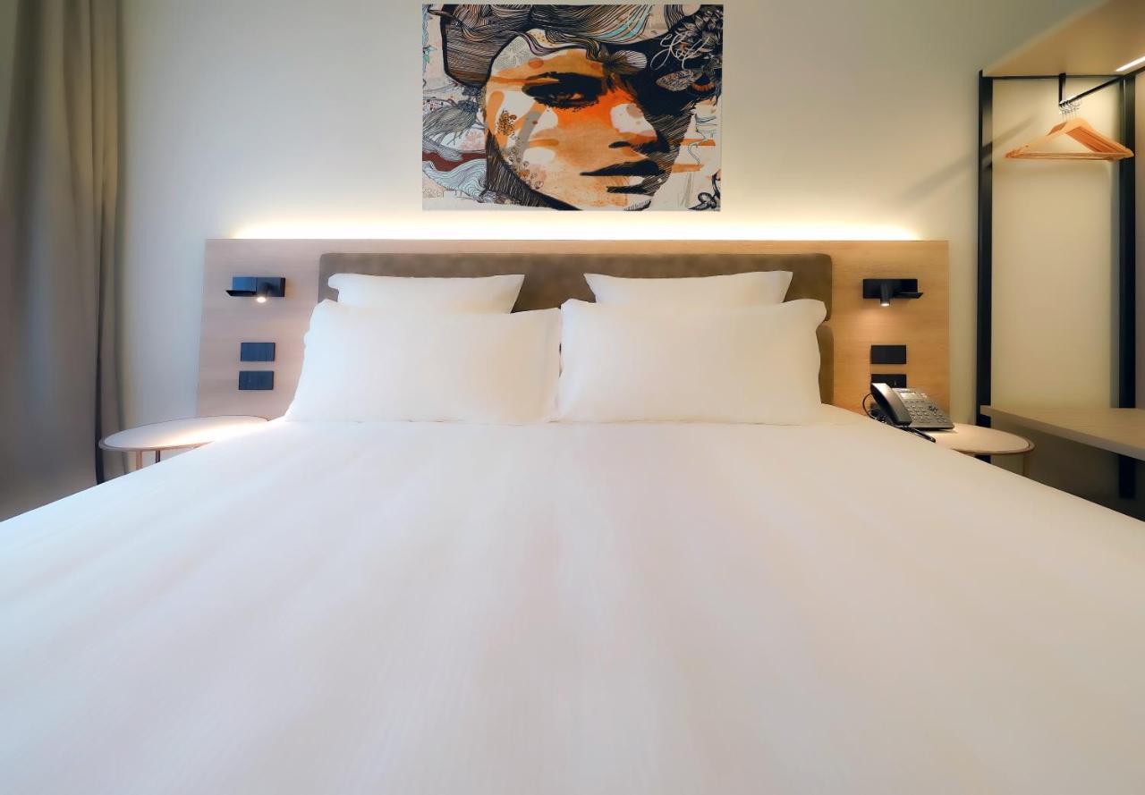 Bergamo INN 21 Bagian luar foto A room at the hotel